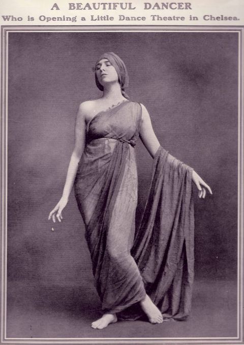Ad. A black and white photograph shows a woman, Margaret Morris, standing with most of her weight on one foot. The other knee bends inwards, the toes brushing the floor. Head tipped back and eyes closed, she lifts her arms so the sheer fabric of her toga costume drapes over one forearm.